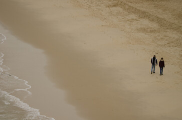 Couple walking on the beach. Cat Co 3 Beach. Cat Ba Island. Cat Ba Archipelago. Vietnam.