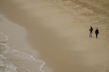Couple walking on the beach. Cat Co 3 Beach. Cat Ba Island. Cat Ba Archipelago. Vietnam.