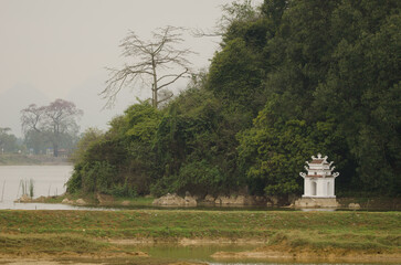 Stupa in Van Long Wetland Nature Reserve. Gia Vien District. Ninh Binh Province. Vietnam.
