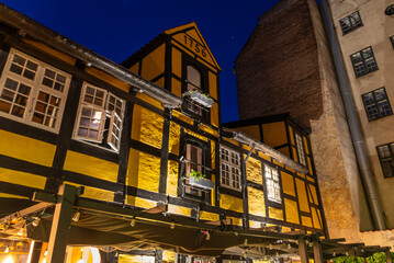 View to Tops of Majestic Historical buildings at night in the center of Copenhagen, Denmark.
