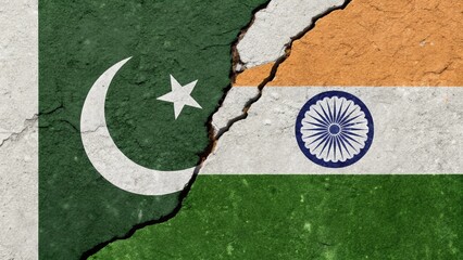 indo-pakistan rivalry concept with broken wall between indian and pakistani flags


