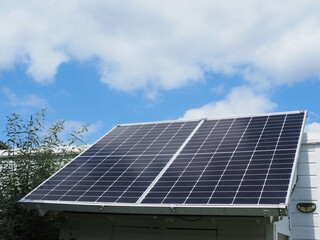 Solar panels on a garden house roof, private energy supply
