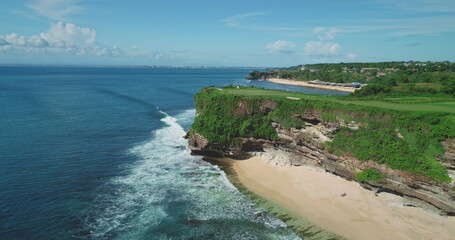 Stunning aerial view of Pantai Dreamland Beach in Bali, Indonesia, featuring turquoise waters,...