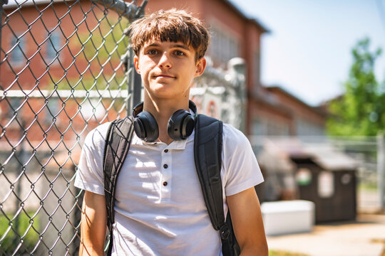 Portrait of smiling elementary school boy with his backpack