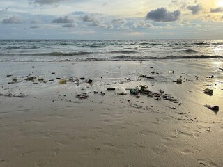Plastic Trash and Pollution on Karon Beach, Phuket, Thailand at Sunset