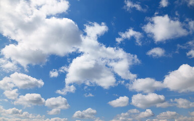 A beautiful blue sky with soft, white clouds, for an abstract background