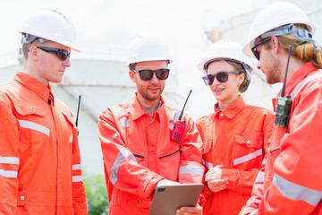 Engineer teams are inspecting and working together in oil and gas refinery facility.