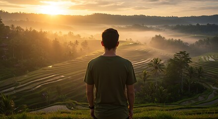 Fototapeta premium Sunrise Over Rice Terraces A Man Contemplates the Breathtaking View