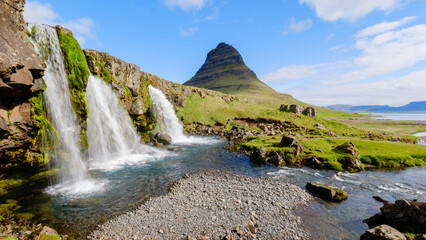 Majestic waterfall cascading near Kirkjufell mountain in stunning Icelandic landscape