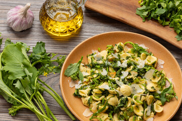 Orecchiette pasta with homegrown broccoli rabe (rapini) - traditional southern Italian cuisine. The...