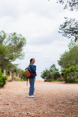 Freelancer enjoying freedom and adventure while working remotely from scenic locations, embracing...