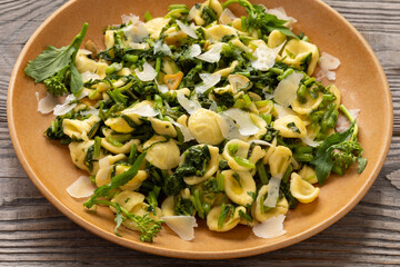 Orecchiette pasta with broccoli rabe (rapini) - traditional southern Italian cuisine. Rapini is a...