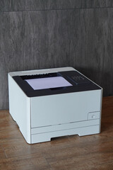 closeup white and black plastic printer and white paper on wood floor, grey tile wall background, technology, object, office, decor, business, copy space