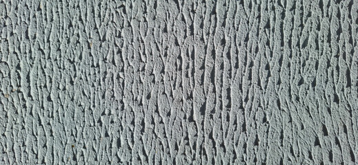 Gray plastered wall.