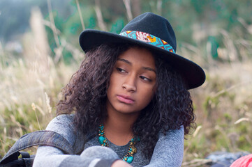 Young hiker feeling sad and discouraged during trekking in nature