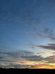 Big white clouds, blue sky and mountains