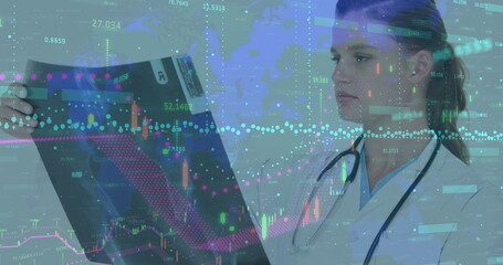 Female doctor holding and examining x-ray film in lab, with stethoscope, data overlays, copy space