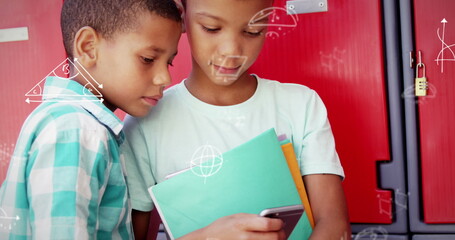 Viewing smartphone, two boys standing in school hallway, with colorful notebooks and math doodles