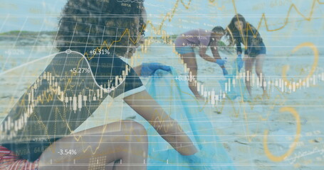 Collecting woman wearing blue gloves moving litter into blue trash bags on beach with stock charts