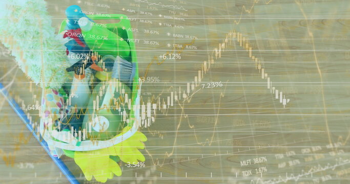 Displaying frog-shaped plush backpack resting on wooden floor with stock charts overlay, copy space - Powered by Adobe