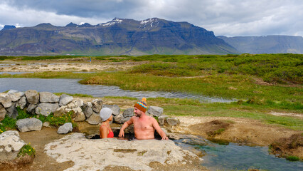 Relaxing in the warm waters of Landbrotalaug Hot Spring surrounded by Icelandic nature