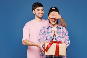 Young couple two friends family man woman they wear pink casual clothes together hold present box...
