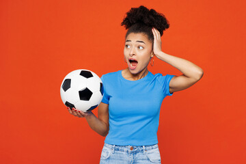 Young shocked surprised happy woman fan wears basic blue t-shirt cheer up support football sport...