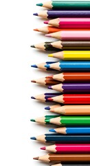 Fototapeta premium Row of colored pencils, sharpened tips. Vivid hues create a dynamic composition against white backdrop.