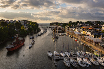 “Sunset over Port‑Rhu marina in Douarnenez, Brittany, with traditional boats and Port‑Musée in view”
