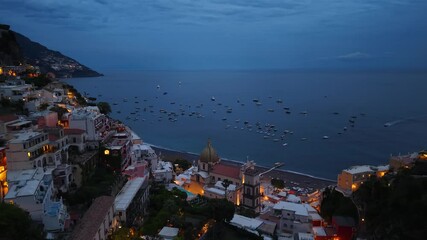 Aerial night view of Positano coastal village on Amalfi Coast in Italy - Powered by Adobe
