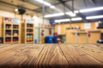 Wooden tabletop in a store with various items on display during daylight hours
