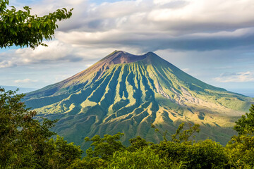 Majestic green volcano landscape under a cloudy sky in central america