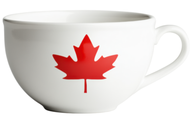 A white ceramic cup features a red maple leaf emblem on its side with a rounded handle.