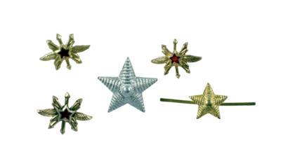 Various military insignia from Soviet Russia displayed together include silver and gold stars along with detailed designs. These symbols reflect historical military rank and significance.