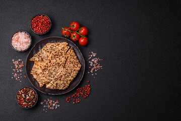 Crispbread, thin bread with seeds and grains, a baked cracker. Crispbread with sesame seeds