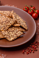 Crispbread, thin bread with seeds and grains, a baked cracker. Crispbread with sesame seeds