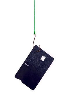 Credit card on fishing hook symbolizing cyber threat