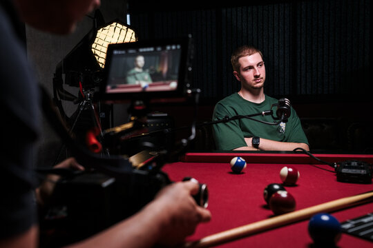 Podcast recording session with host and camera setup