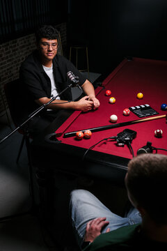 Podcast recording on a pool table setup