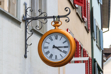 Close-up of big clock on the building in Switzerland