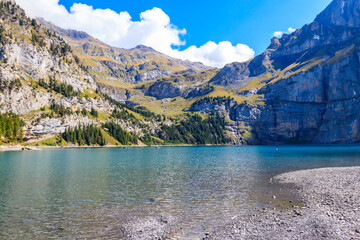 View of Oeschinen lake (Oeschinensee) and Swiss Alps near Kandersteg in Bernese Oberland, Switzerland