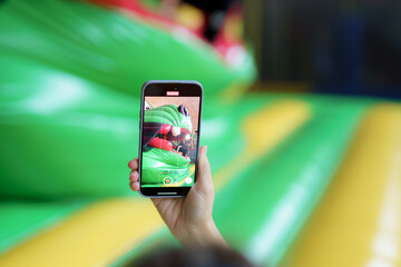 Capturing fun moments at a colorful inflatable playground during a sunny afternoon