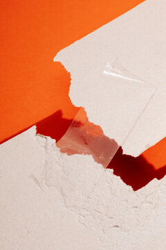 Conceptual image of clear tape on broken white surface