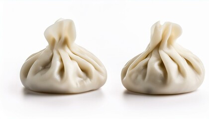 Two steamed dumplings on white background