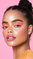 Vibrant makeup artistry: radiant orange shades and glossy pink lips on a pink background