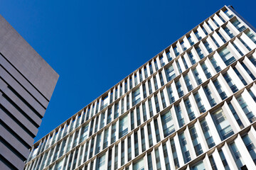 Modern building facade with repetitive architectural elements reaching for the sky