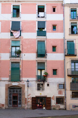 Narrow street with catalan flags flying in barcelona's gothic quarter