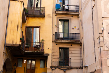 Narrow street with catalan flags flying in barcelona's gothic quarter