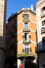 Narrow street with catalan flags flying in barcelona's gothic quarter