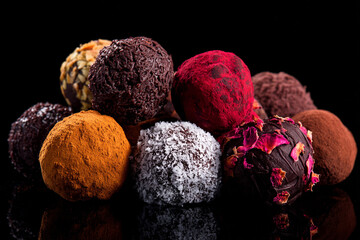 Luxury handmade decorative chocolate bonbon in a display of assorted pralines. AI Generative